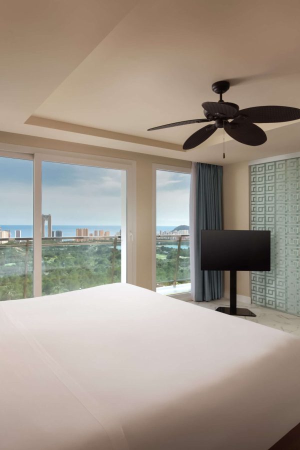 Newly refurbished hotel room with bed, floor to ceiling windows and sea of Alicante